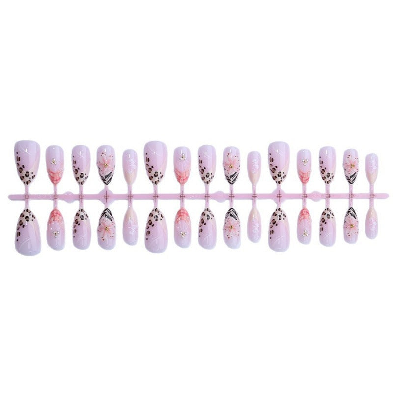 Kunstnagelset mit floralen und Leoparden-Designs Karnz