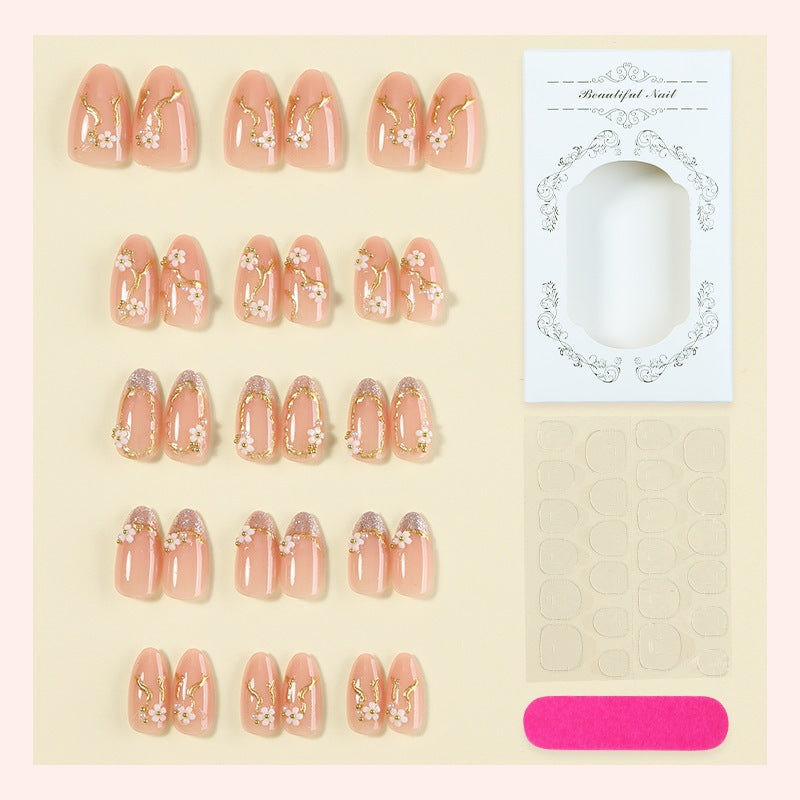 Kreatives Kunstnagelset mit zarter Blumendekoration und Glitzerelementen Karnz