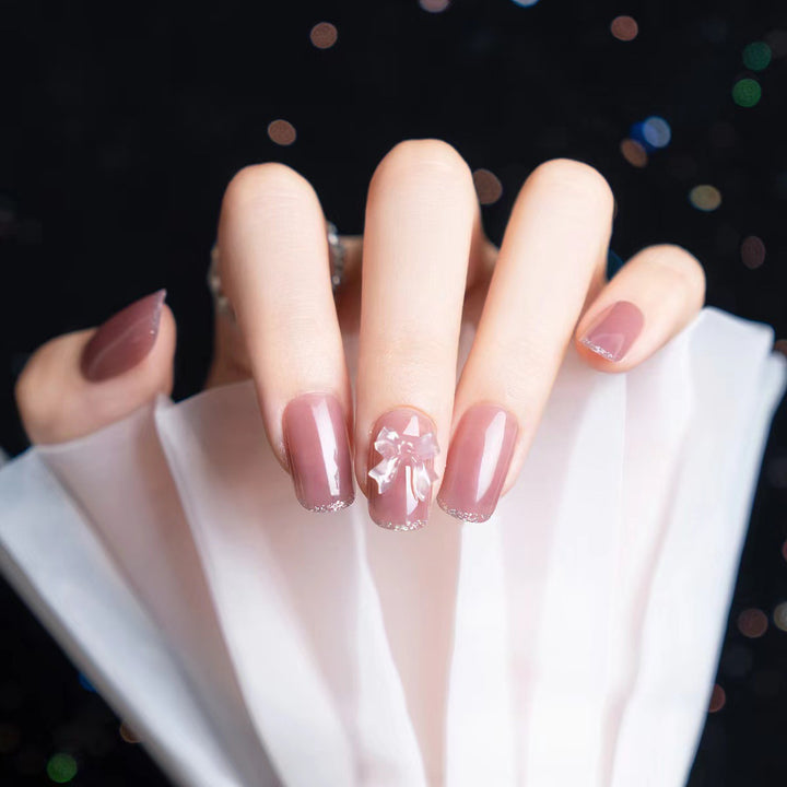 Elegantes Press-On-Nagelkunst-Set mit Schleifenakzenten