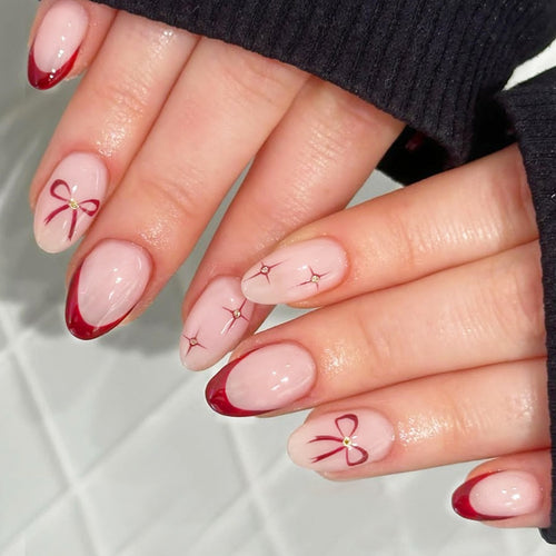 Kunstnagelset mit elegantem Bogen-Design und Glitzereffekten Karnz