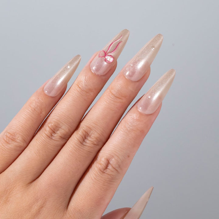 Elegantes Stiletto Press-On Nagelset mit Schleifenakzenten Karnz