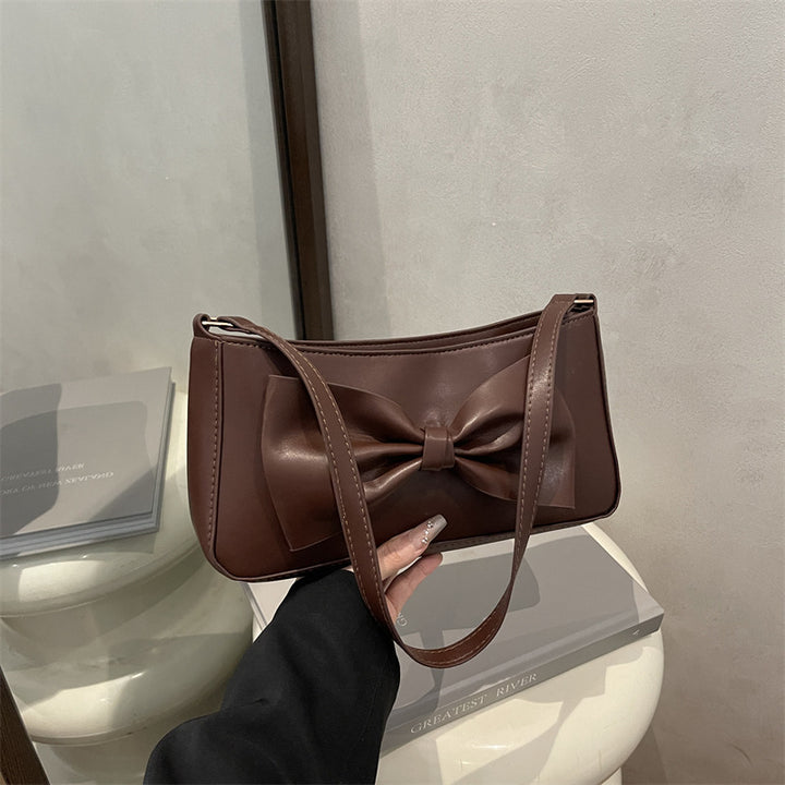 Elegante Clutch mit Schleifen-Detail für den Abend