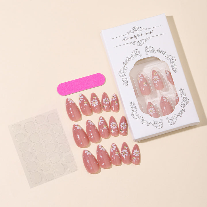 Kunstnägel Set mit eleganten Blüten und Glitzerakzenten Karnz