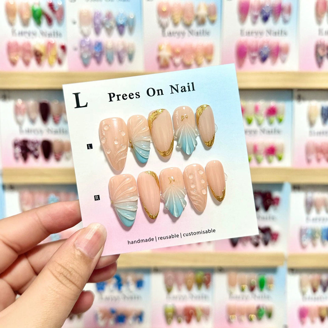 Künstlerisches Press-On-Nagelset mit Muschelmotiven