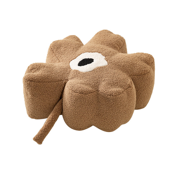Blumenförmiger Bodensitzpouf mit Bouclé‑Bezug und segmentierter Polsterung