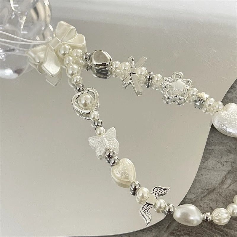 Herz und Schmetterling Charm Perlenarmband Karnz