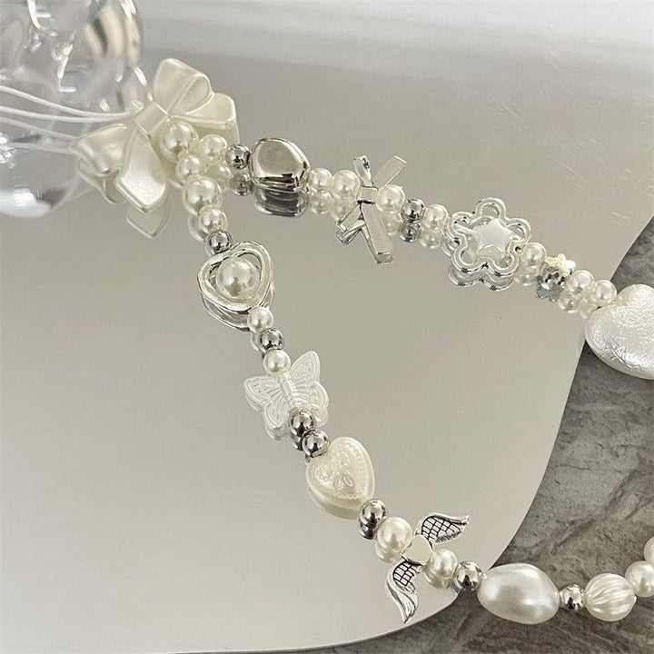 Herz und Schmetterling Charm Perlenarmband Karnz