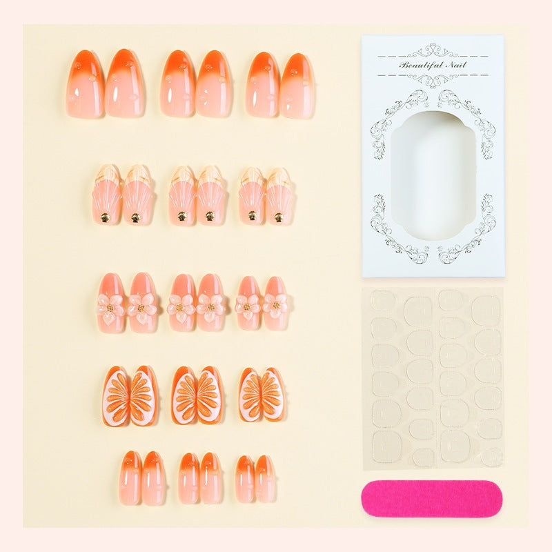 Kreatives Nagelset mit Blumen- und Fruchtverzierungen Karnz