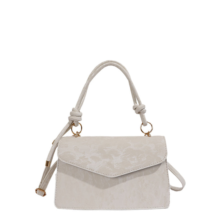 Elegante floral prägte Handtasche