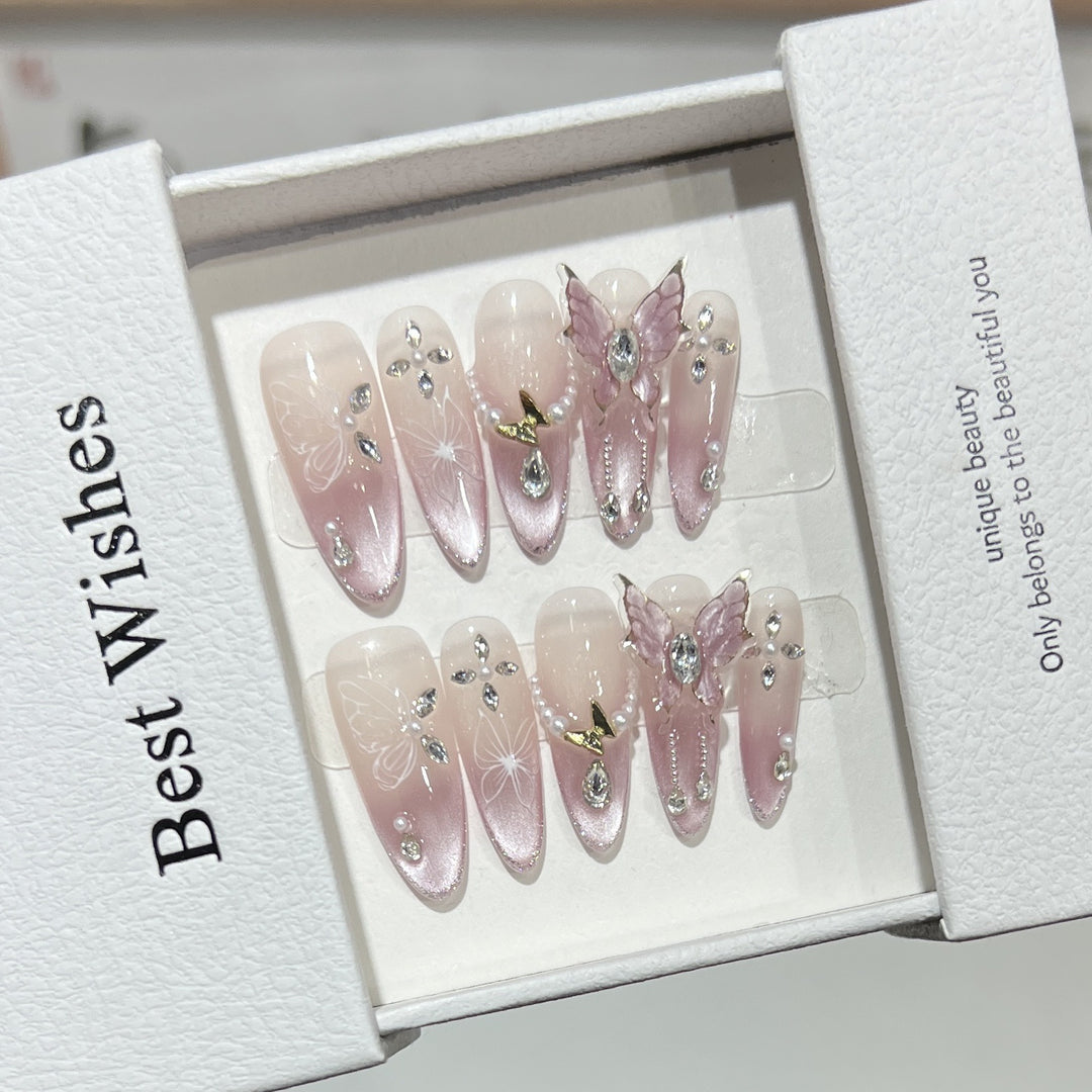 Künstlerisches Stiletto Press-On Nageldesign-Set mit Schmetterlings- und Edelsteinakzenten Karnz