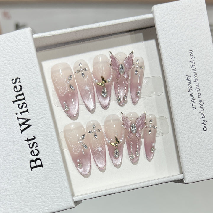 Künstlerisches Stiletto Press-On Nageldesign-Set mit Schmetterlings- und Edelsteinakzenten Karnz