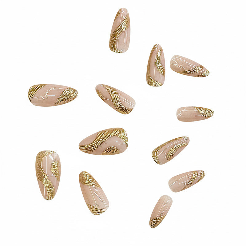 Künstlerisches Press-On Nagelset mit goldener Wirbel-Design Karnz