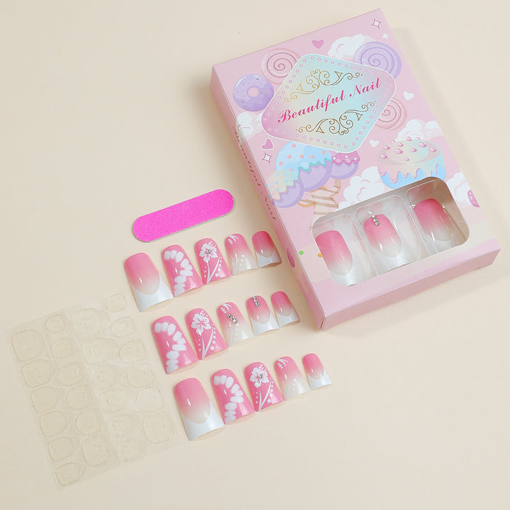 Kunstnagelset mit eleganten Floral-Designs und Glitzerakzenten Karnz