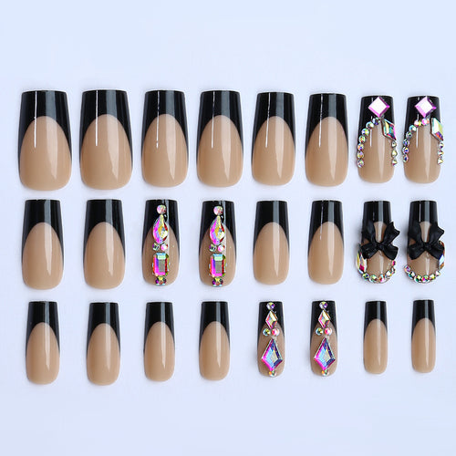 Glamouröses Kunstnagelset mit funkelnden Strass- und Schleifenverzierungen Karnz