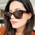Damen stylische Sonnenbrille im modernen Design mit transparentem Rahmen Karnz