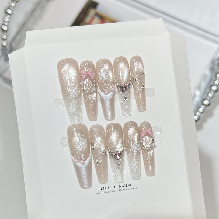 Dekorativer Stiletto Press-On Nagelset mit Strass- und Glitzerakzenten Karnz
