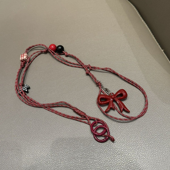 Verspielter Perlen Charm Brillenhalter Karnz