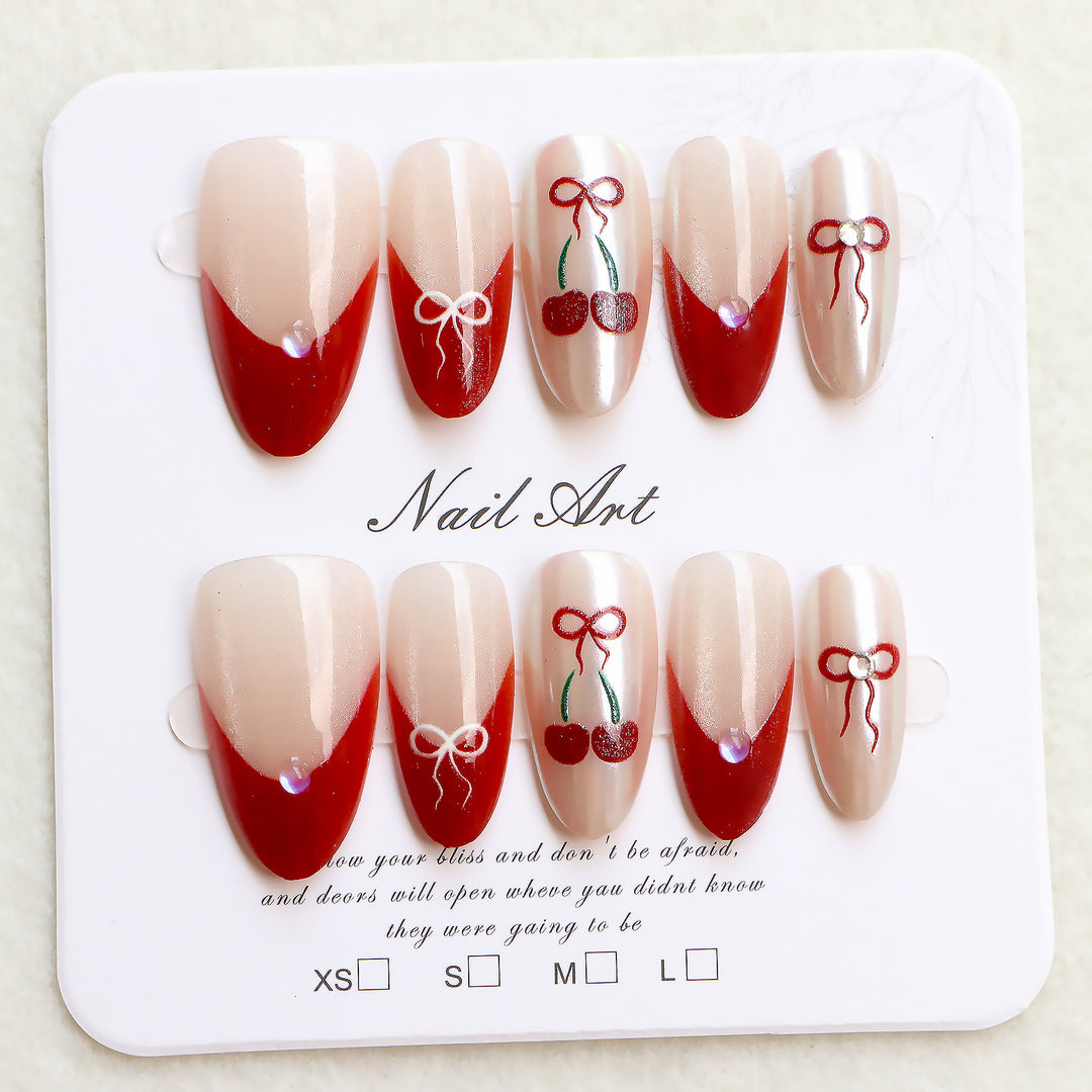 Künstlerisches Press-On-Nagelset mit Kirsch- und Schleifendessin Karnz