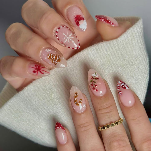 Kunstnagelset mit festlichen Motiven und Glitzerakzenten Karnz