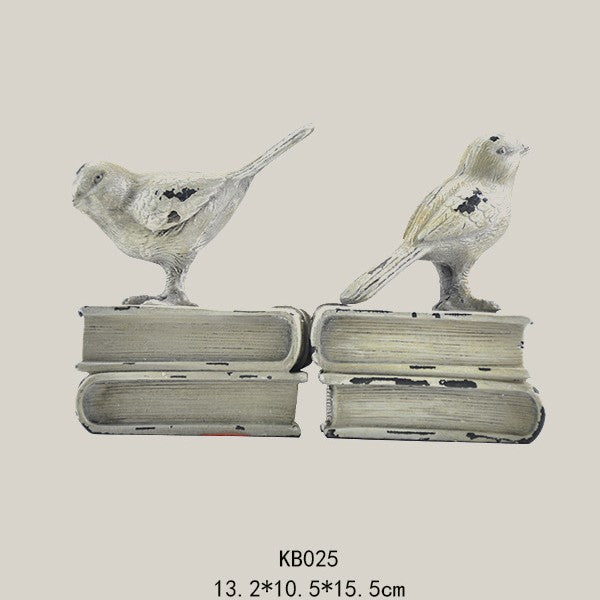 Dekorative Buchstützen mit Vogel-Figuren
