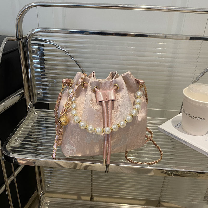 Elegante Blumenmuster-Zugband-Eimer-Tasche Karnz