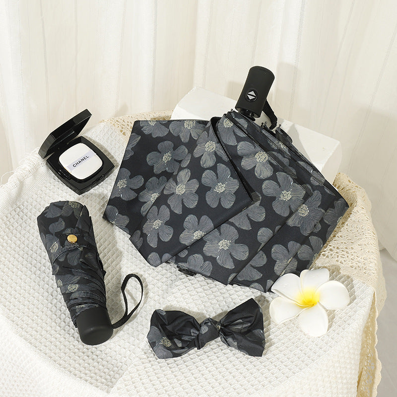 Damen Mini Faltregenschirm mit elegantem Blumendruck Karnz