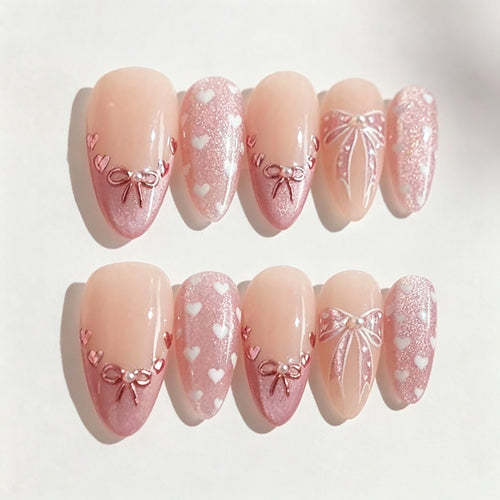 Dekoratives Press-On Nagelkunst Set mit Herz- und Schleifen-Designs