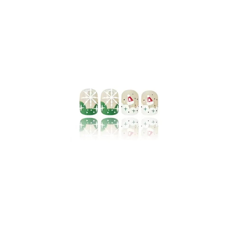 Kunstnagelset mit weihnachtlichen Motiven und Glitzerakzenten Karnz