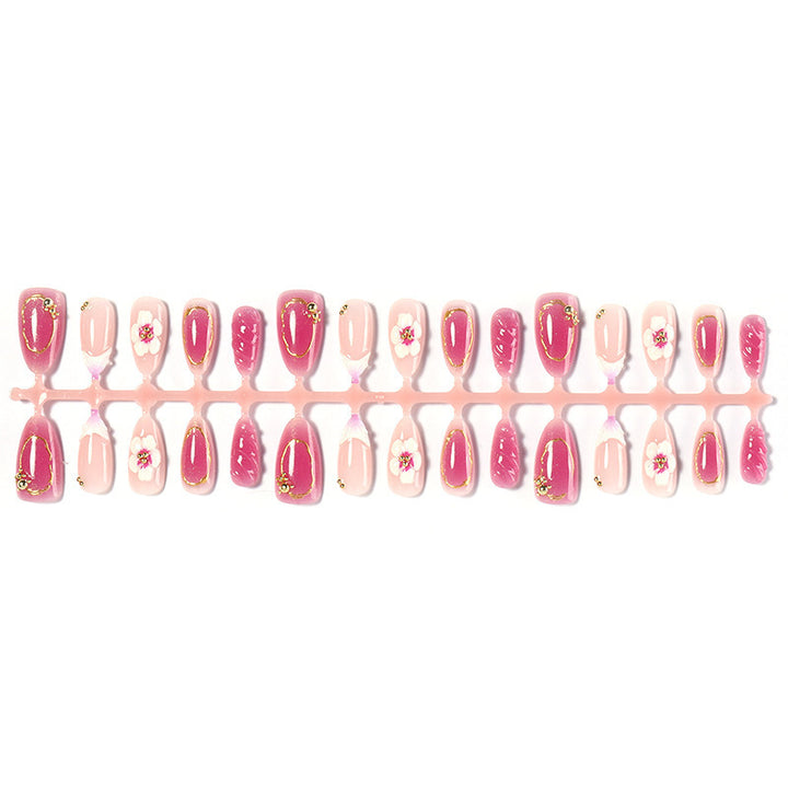 Kreatives Kunstnagelset mit floralen Akzenten und Glitzerverzierungen Karnz
