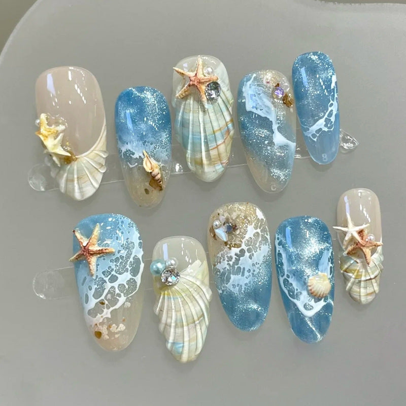 Kunstnägel mit maritimem Muschelmuster Karnz