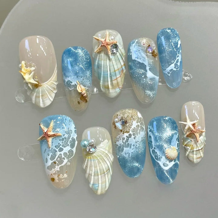 Kunstnägel mit maritimem Muschelmuster Karnz