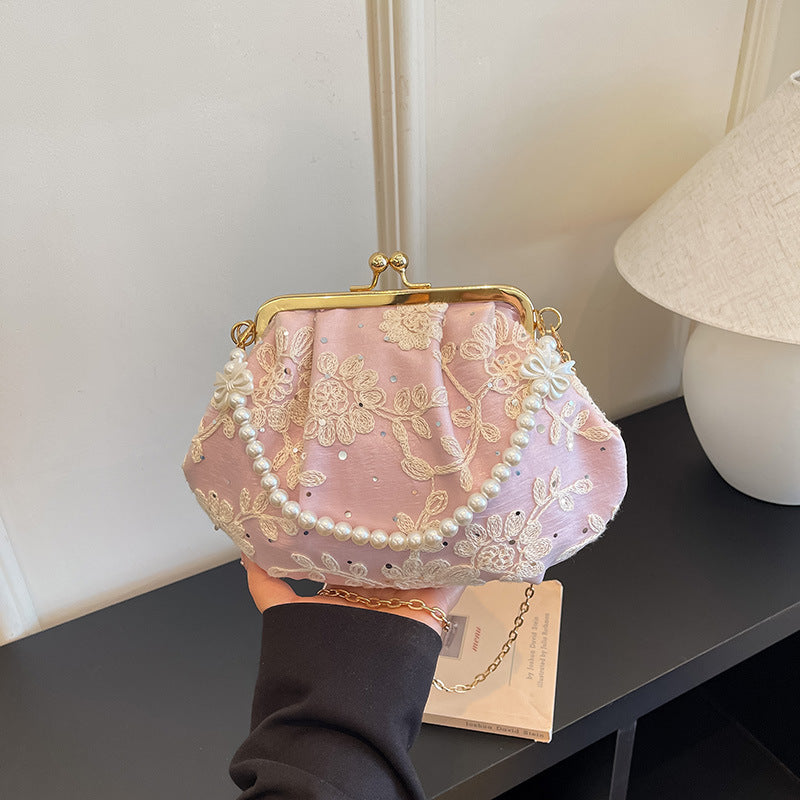 Gestickte Clutch-Handtasche mit Perlenakzenten