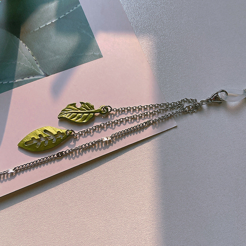 Modische Brillenhalterkette mit Blattmotiven Karnz
