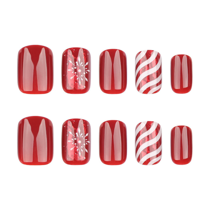 Kunstnagelset mit festlichen Designs und Glitzerakzenten Karnz