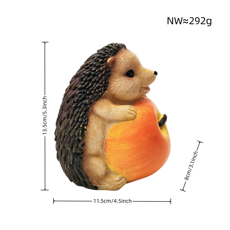 Niedliche Igel Skulptur mit Obst Karnz