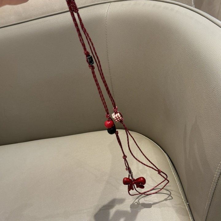 Verspielter Perlen Charm Brillenhalter Karnz
