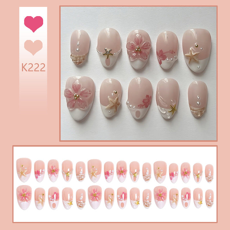 Kunstnagelset mit floralen und maritimen Designs Karnz