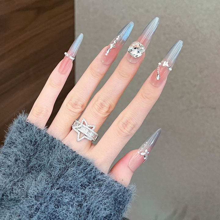 Dekorative mit Kristallen verzierte lange Stiletto Press-On Nägel Karnz
