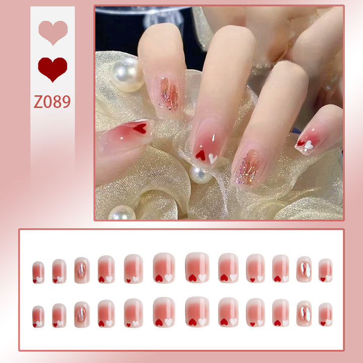 Kunstnagelset mit elegantem French-Tipp und Glitzerakzenten Karnz
