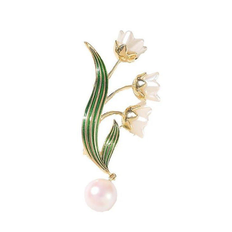 Elegante Blütenbrosche mit Perlenanhänger Karnz