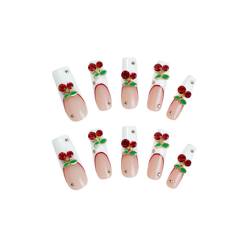 Kunstnagelset mit Kirschmotiv und funkelnden Strasssteinen Karnz