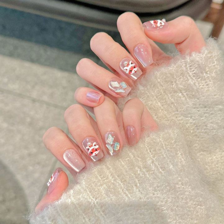 Dekoratives Press-On Nagelkunstset mit eleganten Blumenmustern
