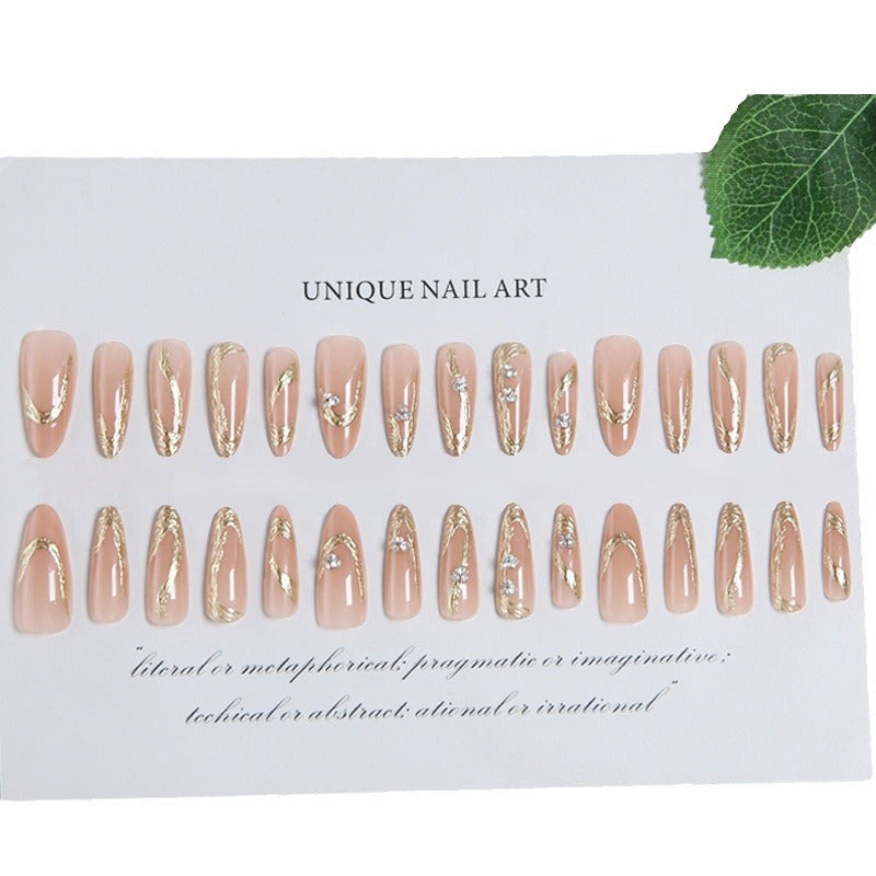 Kunstnagelset mit elegantem Gold-Design und funkelnden Applikationen Karnz