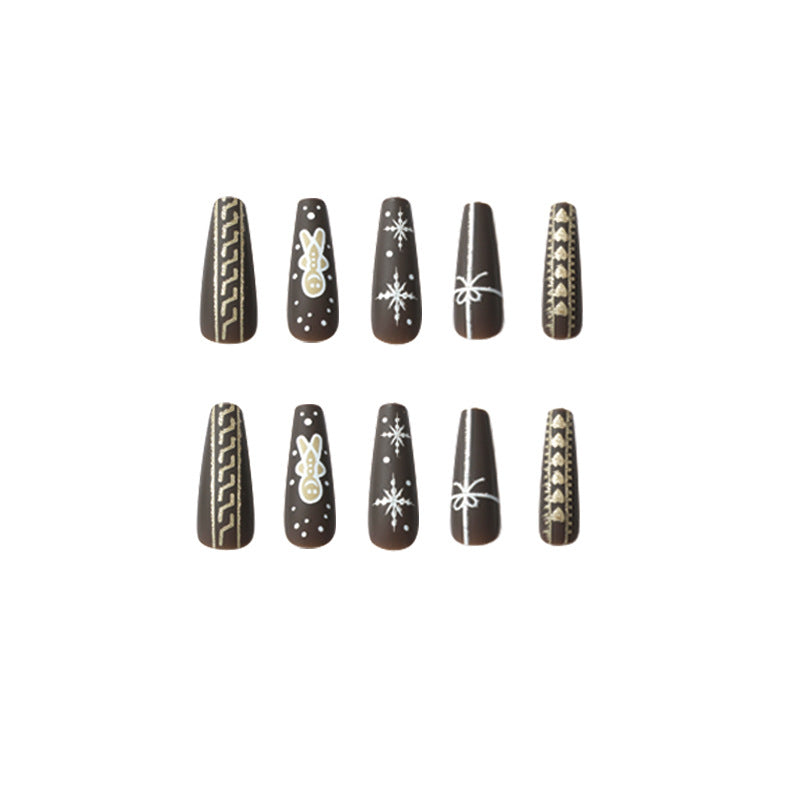 Künstliche Nagelkunst mit festlichem Lebkuchen-Design Karnz