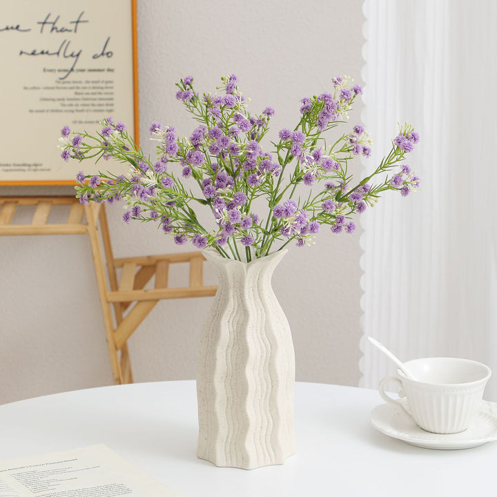 Dekorativer Kunstblütenzweig mit filigranen lila Blüten Karnz