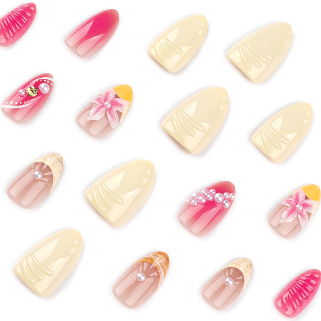 Kunstvolle Nagelverlängerungen mit floralen und perlenverzierten Akzenten Karnz