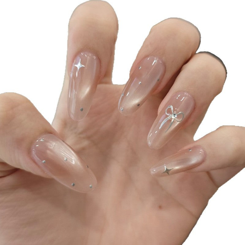 Elegante Stiletto Nageltips mit Schleifenakzenten Karnz