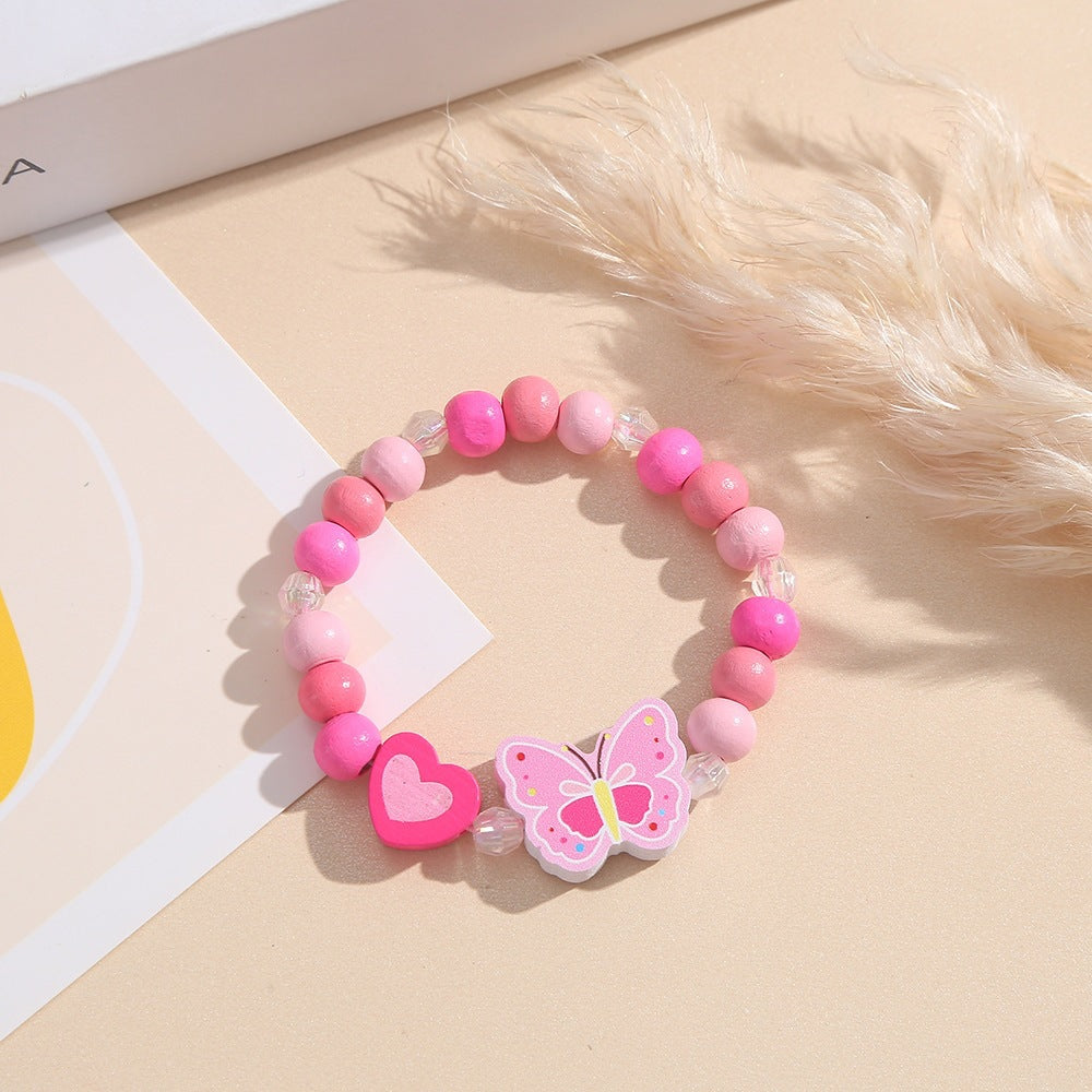 Verspieltes Armband mit Herz- und Schmetterlings-Anhängern Karnz