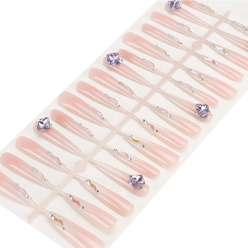 Künstlerisches Stiletto Press-On Nagelset mit Glitzer und Edelsteinakzenten Karnz
