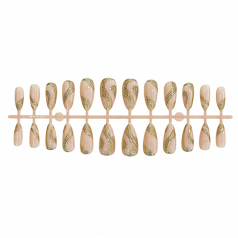 Künstlerisches Press-On Nagelset mit goldener Wirbel-Design Karnz